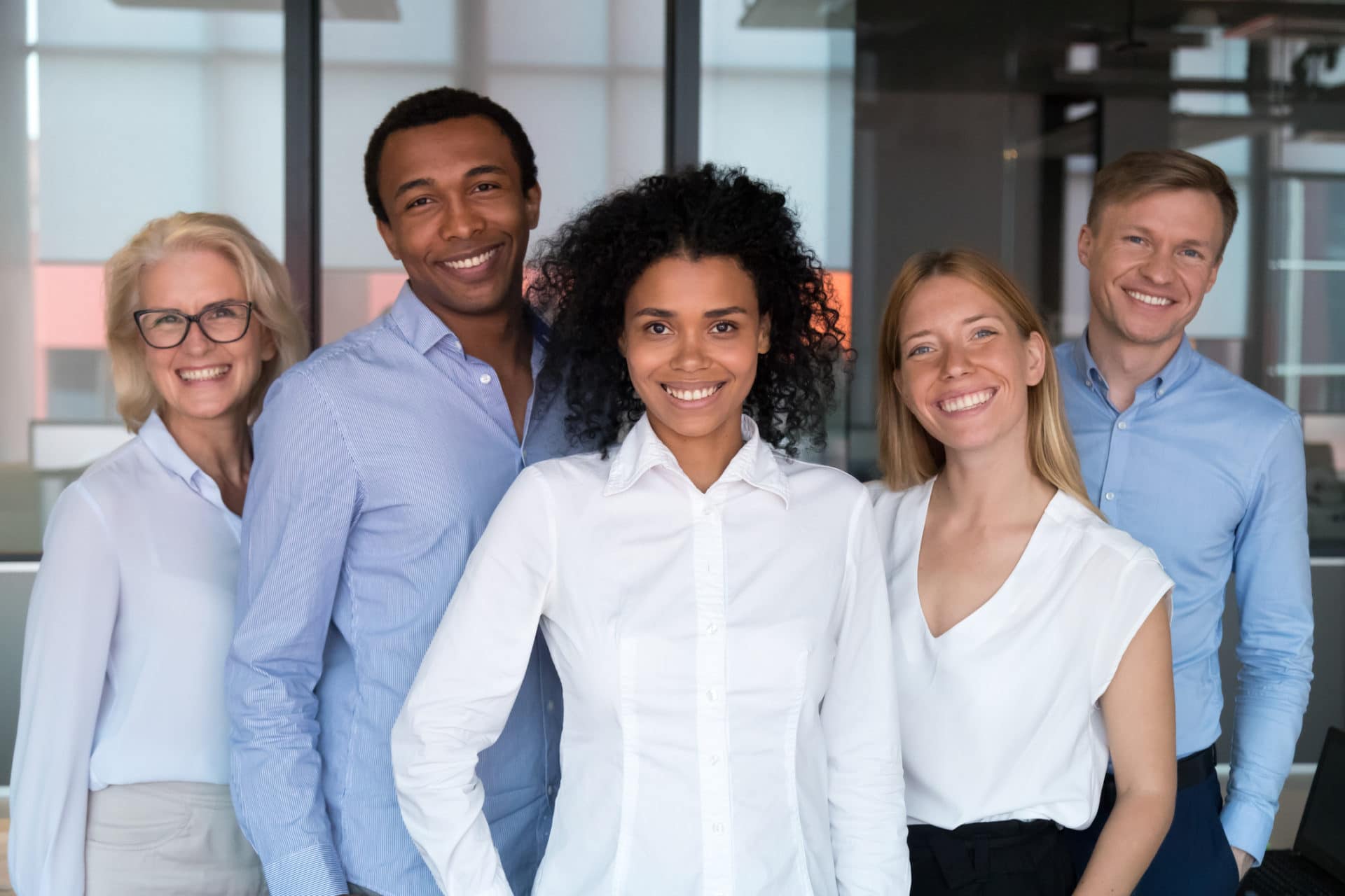 Five employees of a local IT company stand ready to help with any questions or concerns.